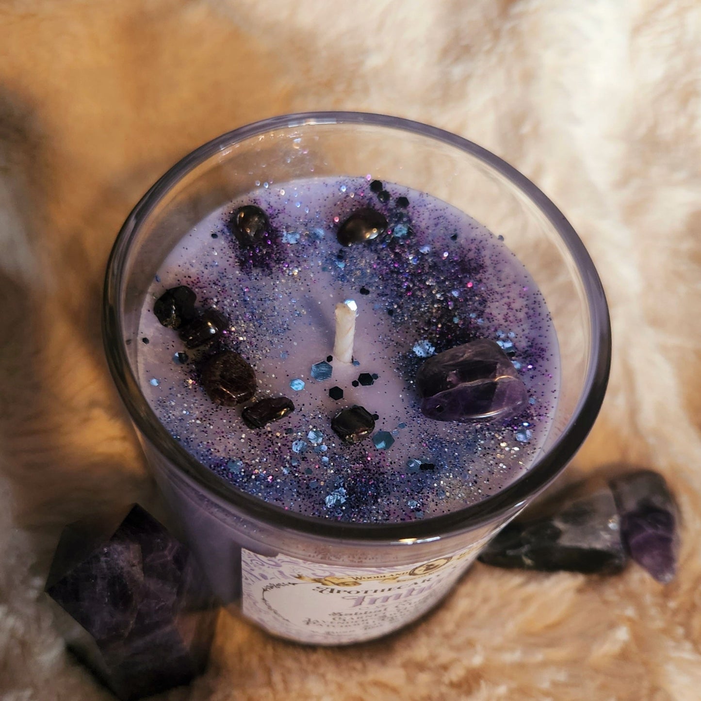 Imbolc Ritual candle top view with amethyst crystals